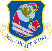 Crest for the 145th Airlift wing, a wright brothers airplane flies around a globe on a blue shield outlined in gold. 145th Airlift Wing is written below. 